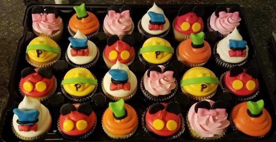 Tray of hand-decorated character cupcakes