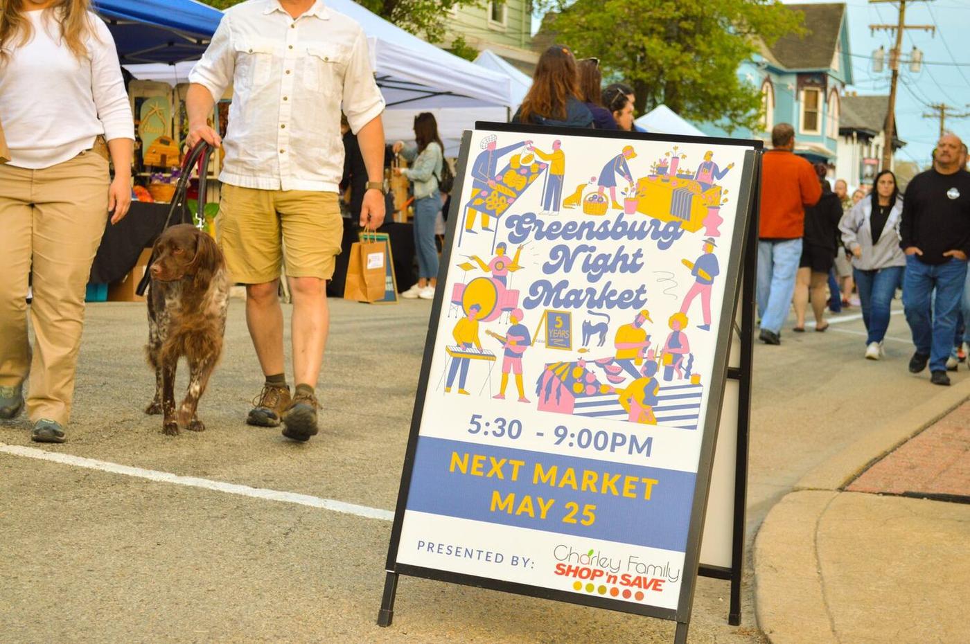 Greensburg Night Market sign, presented by Charley Family Shop 'n Save
