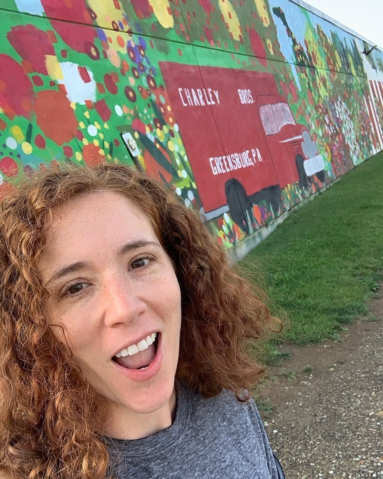 Sarah Dumnich at the Charley Brothers mural in Greensburg