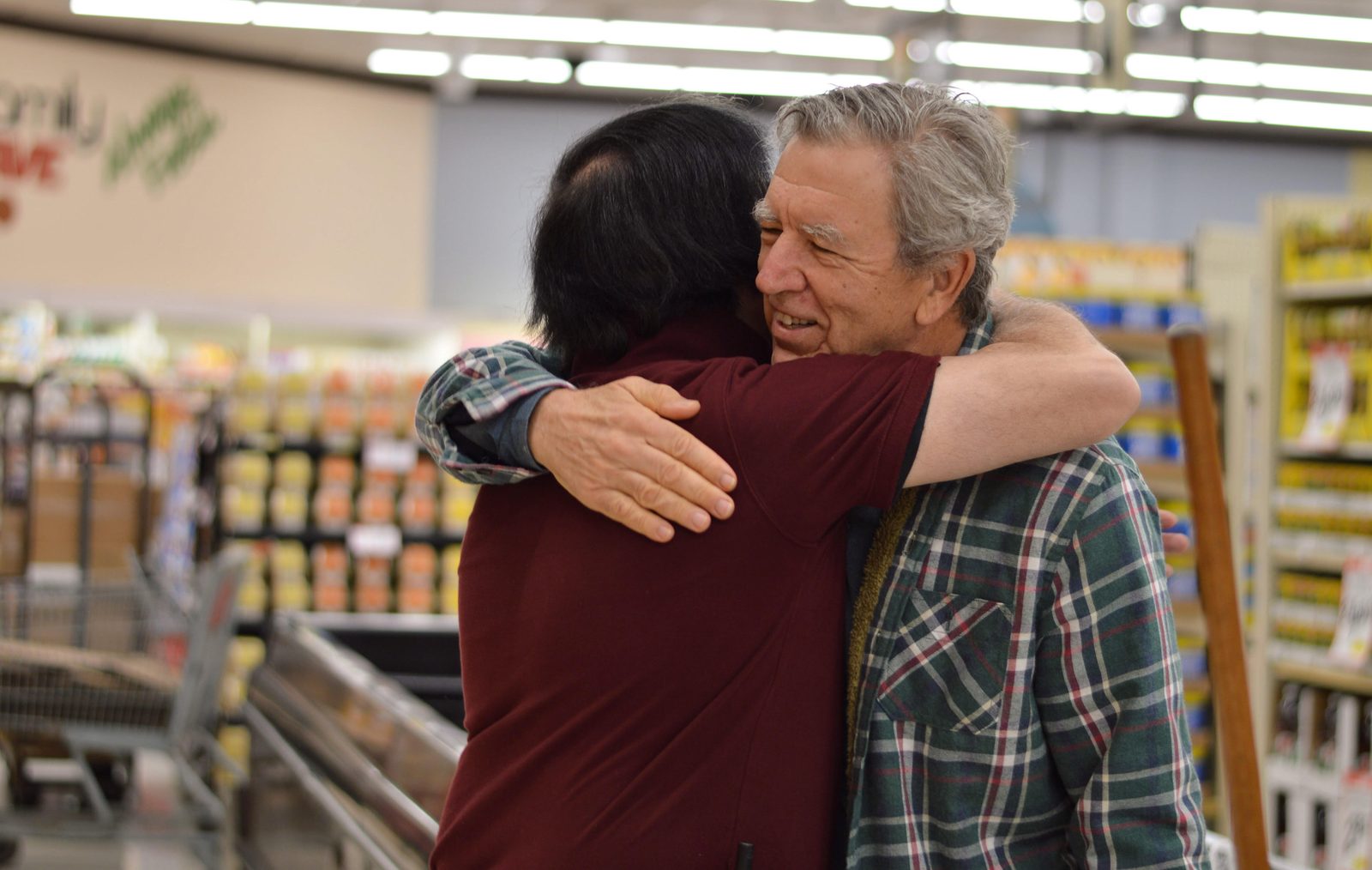 A hug between old friends in the aisle - this is what locally owned looks like